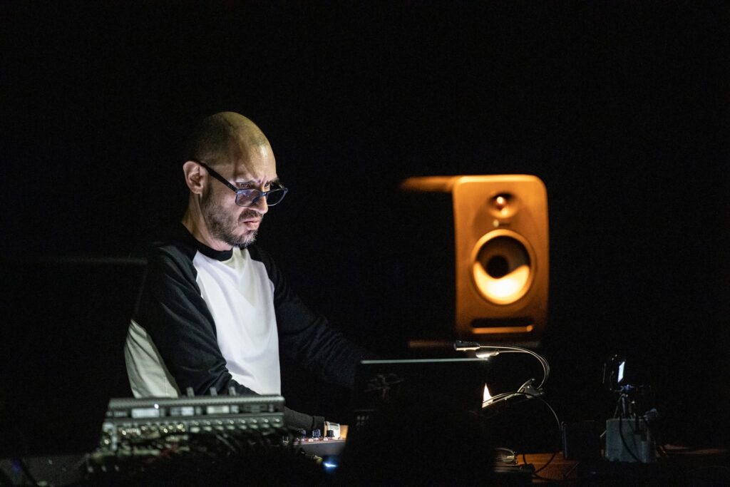 Amok, photo of Enrique Mendoza playing the synths