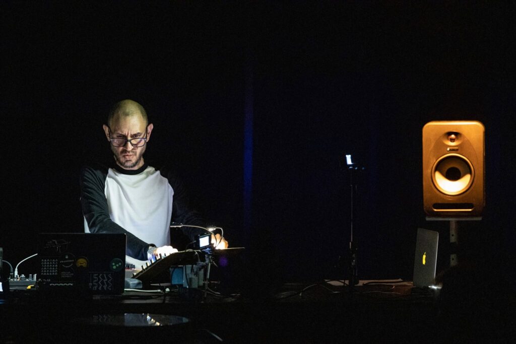 Amok, photo of Enrique Mendoza playing the synths